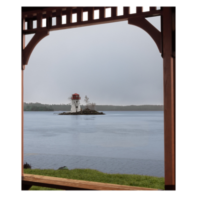 Lighthouse in the middle of water with gazebo wood framing it in Callander, Ontario