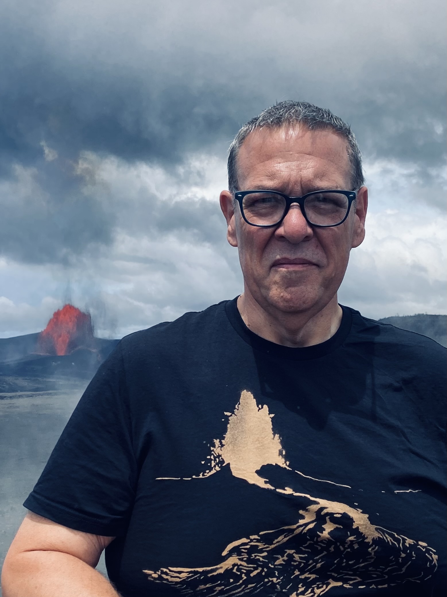 Michael R. Cavitt in front of a lava fountain at the Kilauea eruption, episode 51